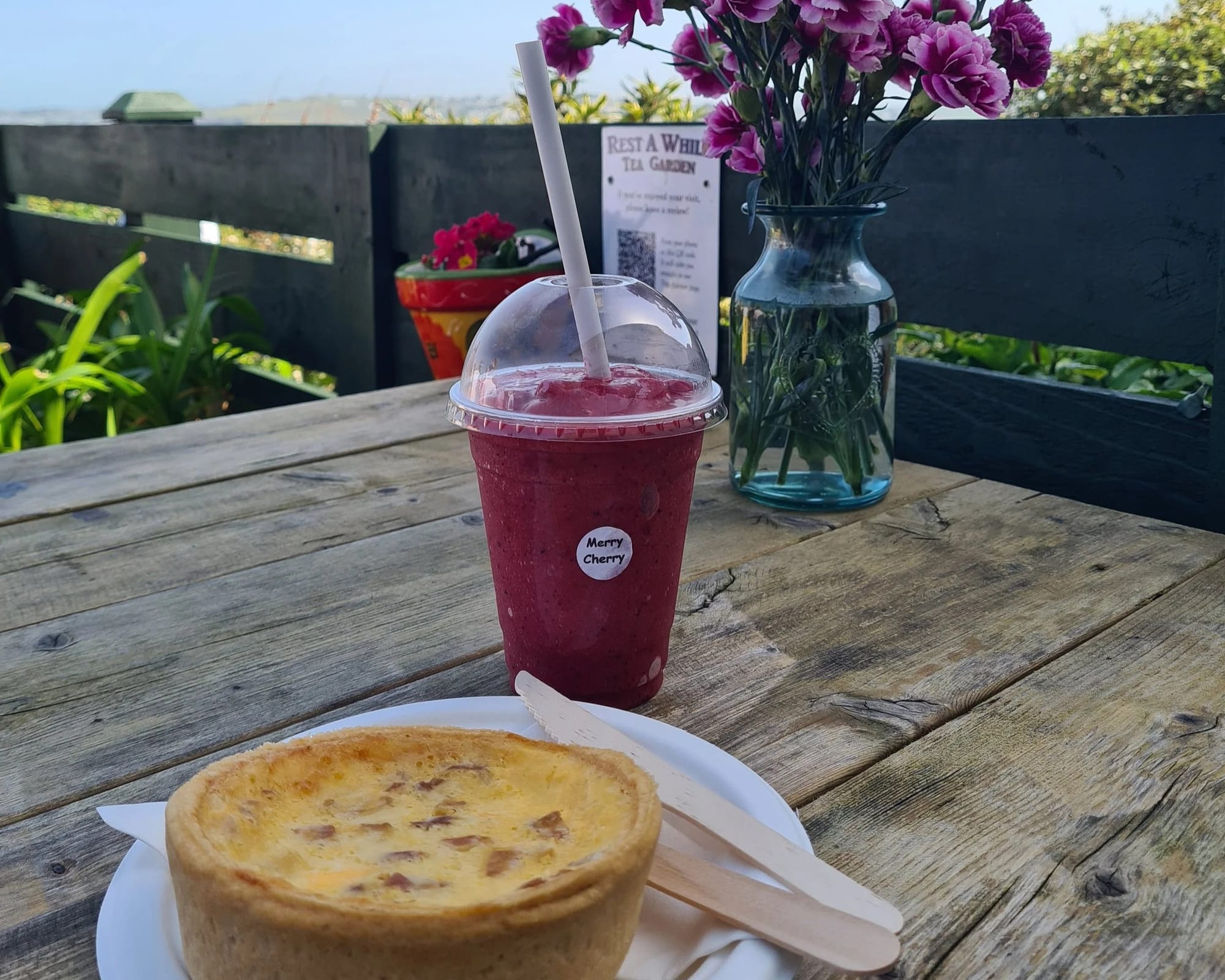 Cherry smoothie and homemade quiche Lorraine served at Rest A While Tea Garden
