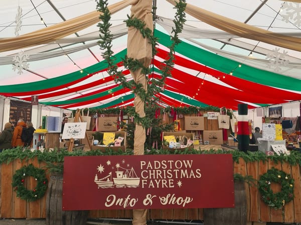 Visitors gather in the Christmas Market tent at Padstow Christmas Fayre